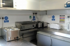Inside small Burger catering trailer